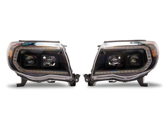 Raxiom 05-11 Toyota Tacoma Axial Series Switchback Projector Headlights- Black Housing- Clear Lens