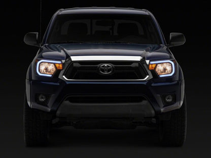Raxiom 12-15 Toyota Tacoma Axial Series Headlights/Seq LED Bar- Black- Clear Lens
