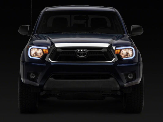 Raxiom 12-15 Toyota Tacoma Axial Series Headlights/Seq LED Bar- Black- Clear Lens