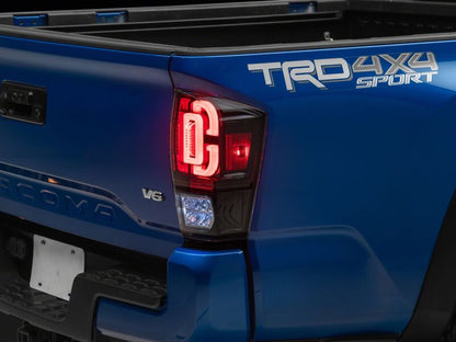 Raxiom 16-23 Toyota Tacoma XW Series Sequential LED Tail Lights- Black Housing- Clear Lens