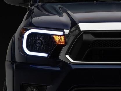 Raxiom 12-15 Toyota Tacoma Axial Series Headlights/Seq LED Bar- Black- Clear Lens